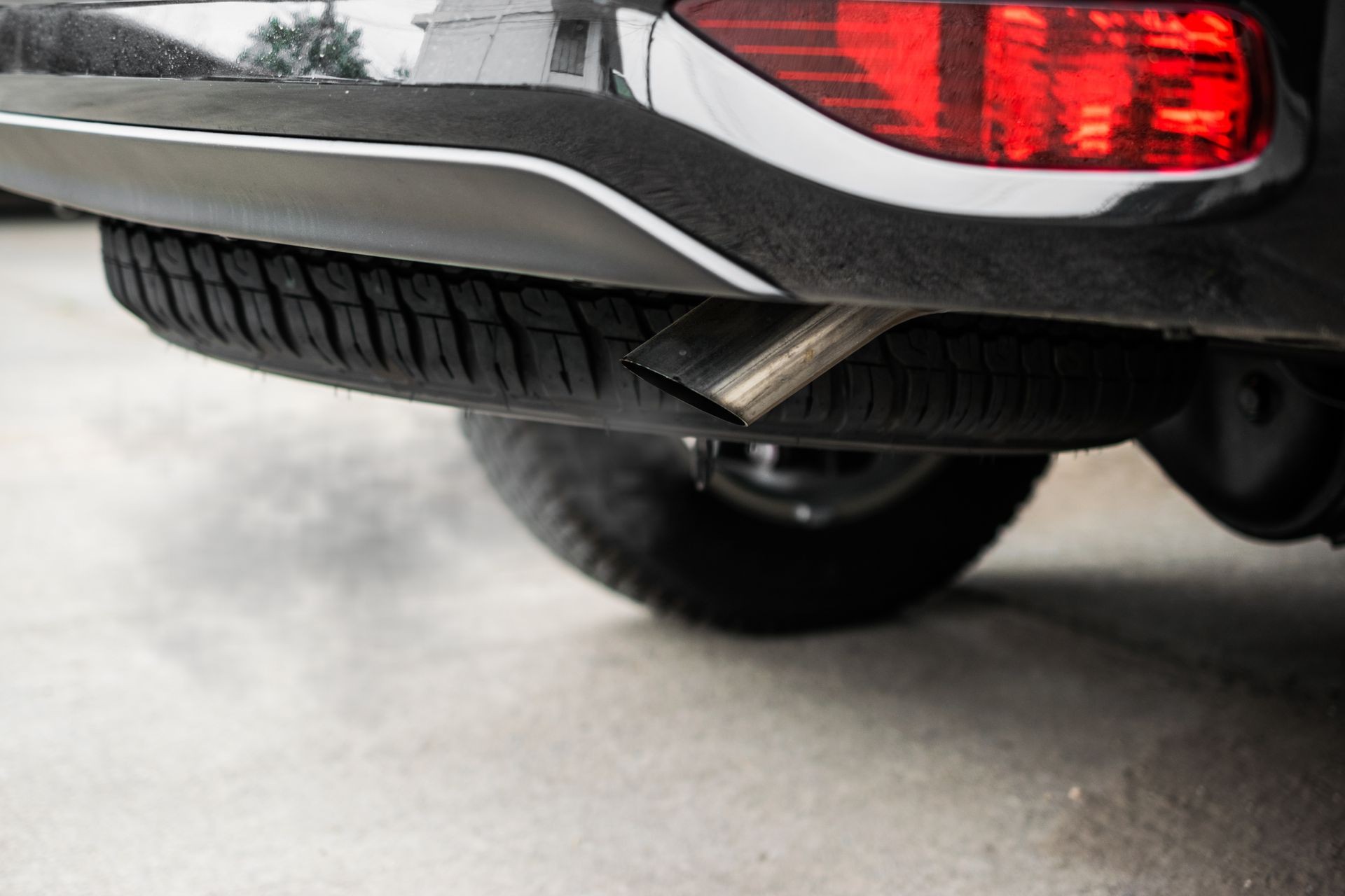 Exhaust from black car , air pollution concept.